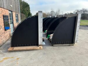 a group of tilting weirs ready for dispatch